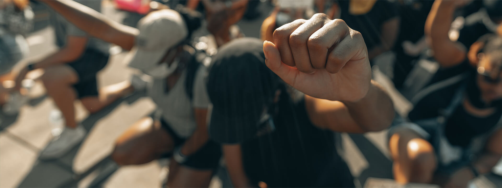 A person with their fist raised in the air